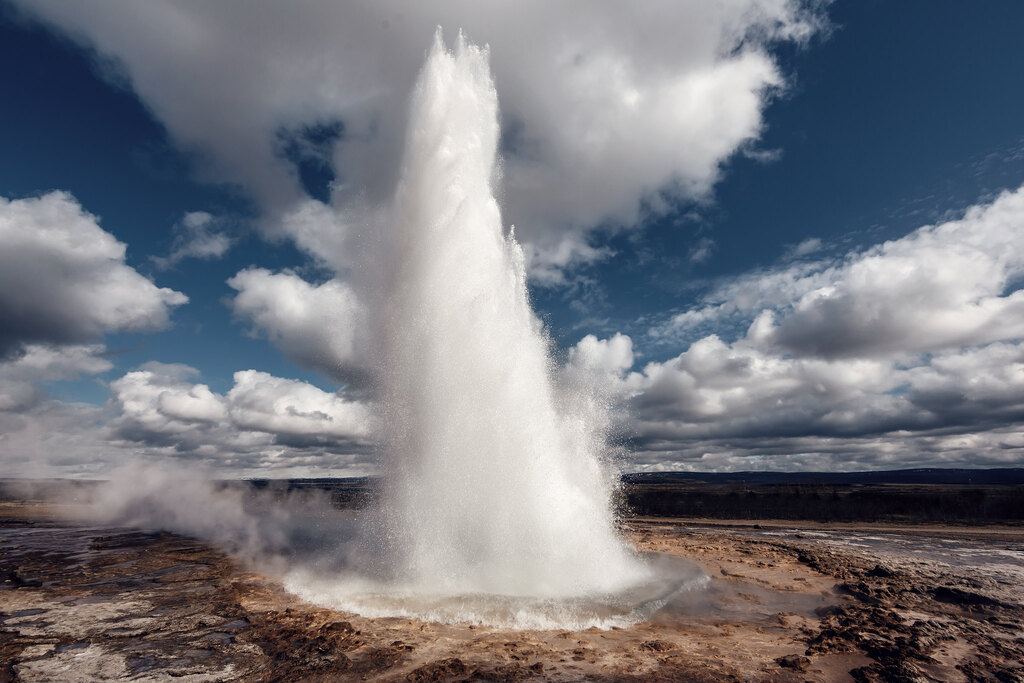 Geysir in Iceland with photographer nice weather