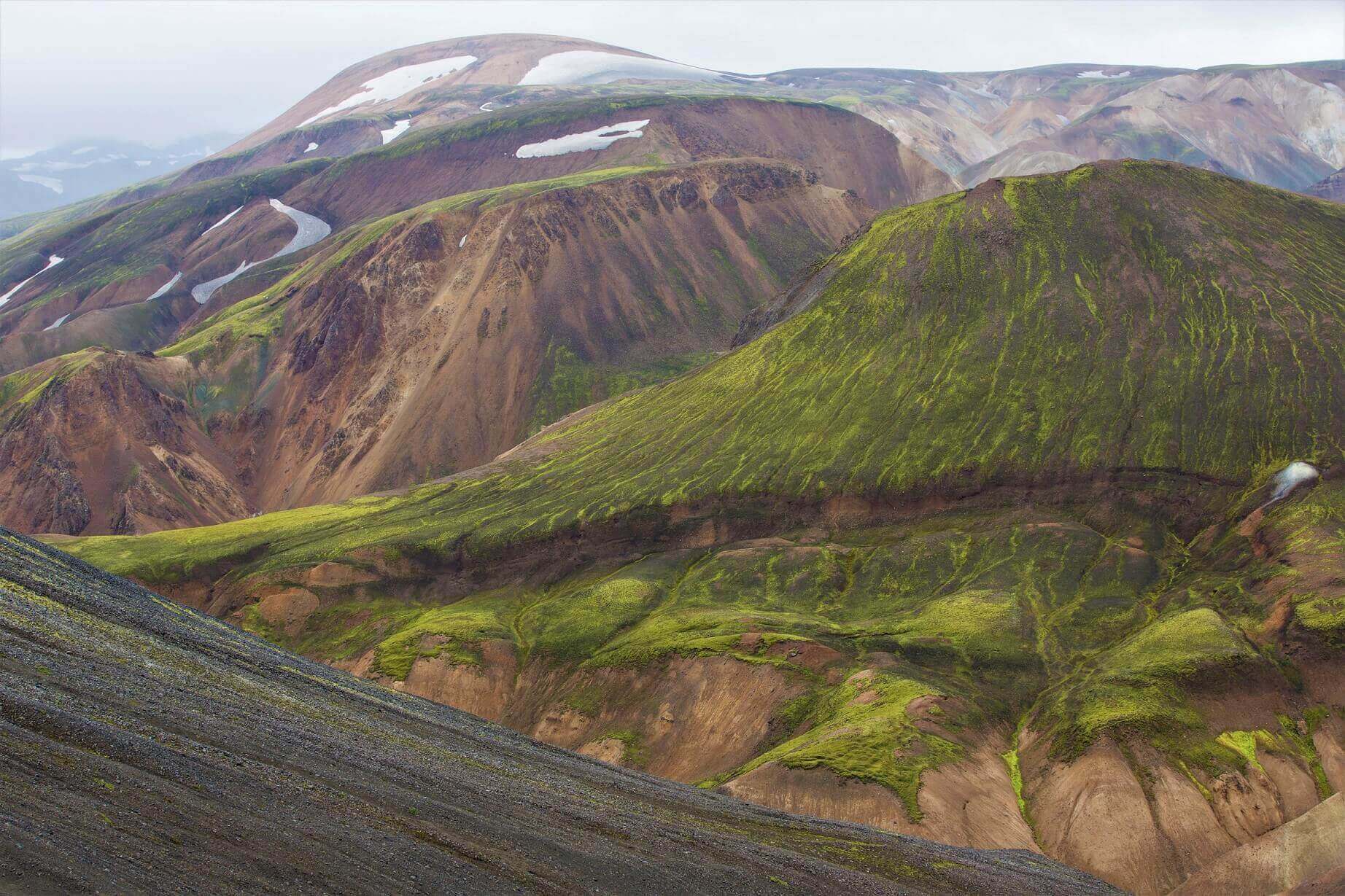 See the colored mountains in Landmannalaugar in Iceland.