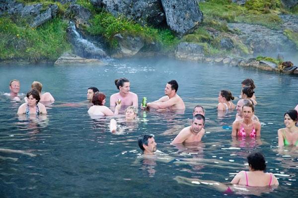 Swim in natural hot springs while hiking the Landmannalaugar trek in Iceland. 